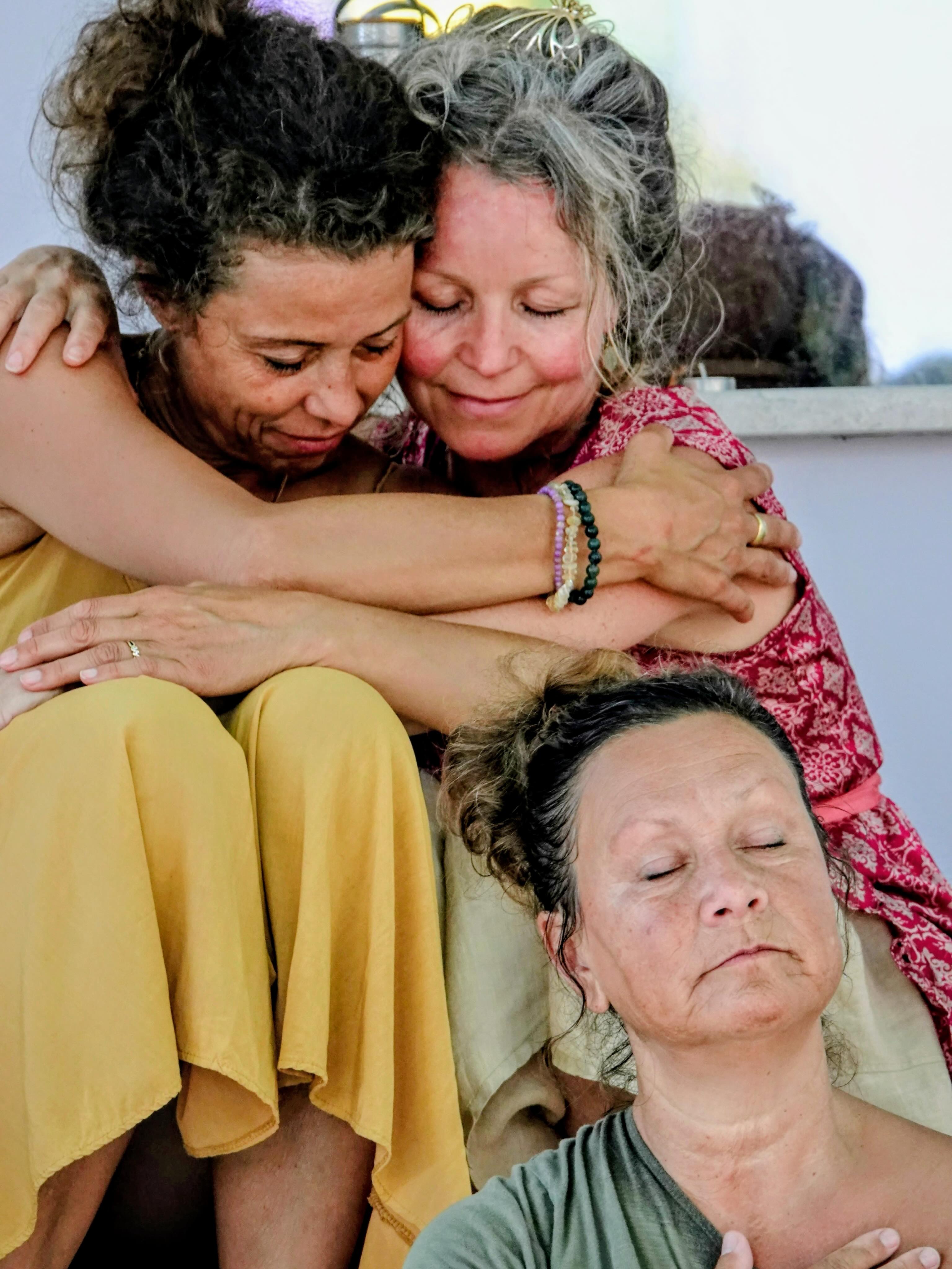 Friends sharing a close group embrace